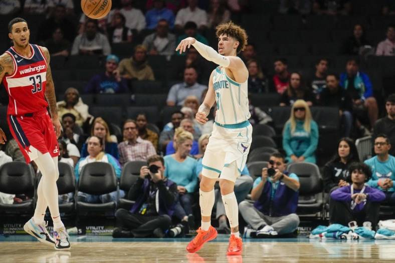Oct 10, 2022; Charlotte, North Carolina, USA; Charlotte Hornets guard LaMelo Ball (1) passes cross court against the Washington Wizards during the first quarter at Spectrum Center. Mandatory Credit: Jim Dedmon-USA TODAY Sports