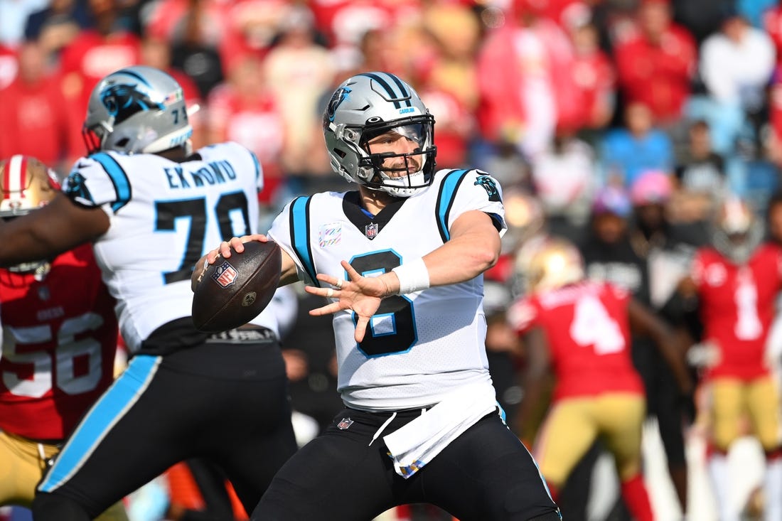 Oct 9, 2022; Charlotte, North Carolina, USA; Carolina Panthers quarterback Baker Mayfield (6) looks to pass as offensive tackle Ikem Ekwonu (79) blocks in the first quarter at Bank of America Stadium. Mandatory Credit: Bob Donnan-USA TODAY Sports