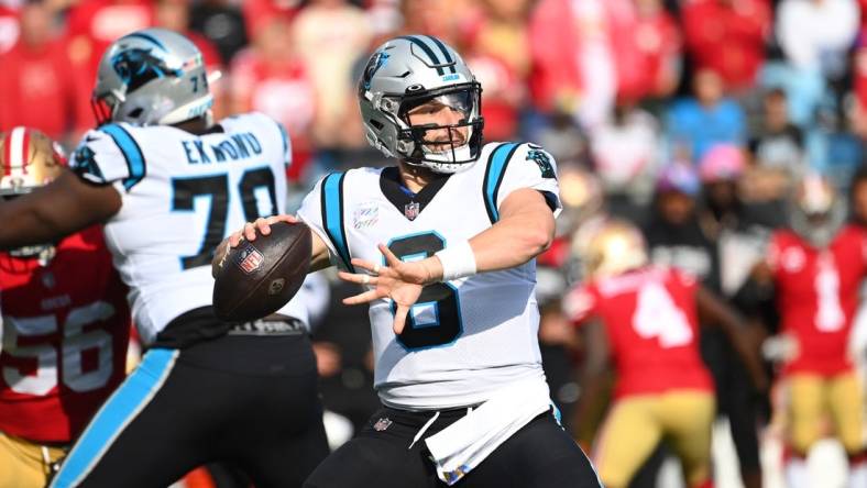 Oct 9, 2022; Charlotte, North Carolina, USA; Carolina Panthers quarterback Baker Mayfield (6) looks to pass as offensive tackle Ikem Ekwonu (79) blocks in the first quarter at Bank of America Stadium. Mandatory Credit: Bob Donnan-USA TODAY Sports