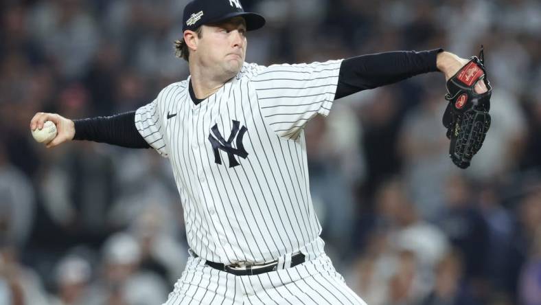 Oct 11, 2022; Bronx, New York, USA; New York Yankees starting pitcher Gerrit Cole (45) throws a pitch during the first inning in game one of the ALDS against the Cleveland Guardians for the 2022 MLB Playoffs at Yankee Stadium. Mandatory Credit: Brad Penner-USA TODAY Sports