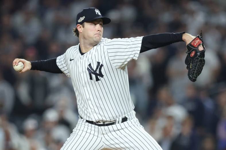 Oct 11, 2022; Bronx, New York, USA; New York Yankees starting pitcher Gerrit Cole (45) throws a pitch during the first inning in game one of the ALDS against the Cleveland Guardians for the 2022 MLB Playoffs at Yankee Stadium. Mandatory Credit: Brad Penner-USA TODAY Sports