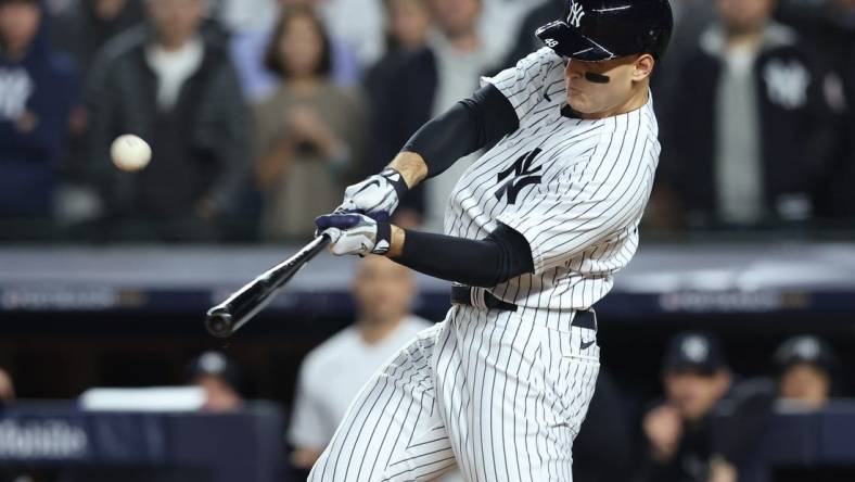 Oct 11, 2022; Bronx, New York, USA;   New York Yankees first baseman Anthony Rizzo (48) hits a home run during the sixth inning against the Cleveland Guardians iin game one of the ALDS for the 2022 MLB Playoffs at Yankee Stadium. Mandatory Credit: Brad Penner-USA TODAY Sports