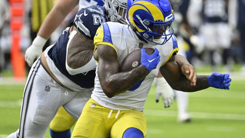 Oct 9, 2022; Inglewood, California, USA; Los Angeles Rams running back Cam Akers (3) is grabbed from behind by Dallas Cowboys defensive tackle Trysten Hill (72) during the  second quarter at SoFi Stadium. Mandatory Credit: Robert Hanashiro-USA TODAY Sports