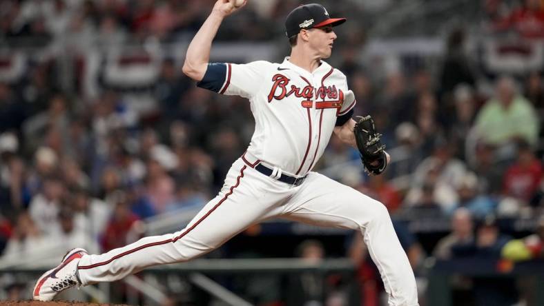 Oct 12, 2022; Atlanta, Georgia, USA; Atlanta Braves starting pitcher Kyle Wright (30) throws against the Philadelphia Phillies in the third inning during game two of the NLDS for the 2022 MLB Playoffs at Truist Park. Mandatory Credit: Dale Zanine-USA TODAY Sports