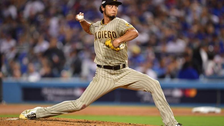 Oct 12, 2022; Los Angeles, California, USA;San Diego Padres starting pitcher Yu Darvish (11) throws during the sixth inning of game two of the NLDS for the 2022 MLB Playoffs against the Los Angeles Dodgers at Dodger Stadium. Mandatory Credit: Gary A. Vasquez-USA TODAY Sports