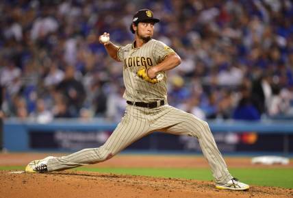 Oct 12, 2022; Los Angeles, California, USA;San Diego Padres starting pitcher Yu Darvish (11) throws during the sixth inning of game two of the NLDS for the 2022 MLB Playoffs against the Los Angeles Dodgers at Dodger Stadium. Mandatory Credit: Gary A. Vasquez-USA TODAY Sports