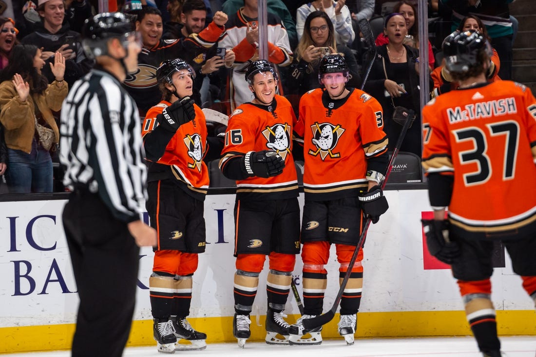 Oct 12, 2022; Anaheim, California, USA; Anaheim Ducks center Trevor Zegras (11) and center Ryan Strome (16) and defenseman John Klingberg (3) celebrate after scoring against Seattle Kraken during the second period at Honda Center. Mandatory Credit: Jonathan Hui-USA TODAY Sports