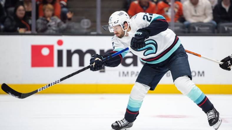 Oct 12, 2022; Anaheim, California, USA; Seattle Kraken right wing Oliver Bjorkstrand (22) shoots the puck against Anaheim Ducks during the first period at Honda Center. Mandatory Credit: Jonathan Hui-USA TODAY Sports