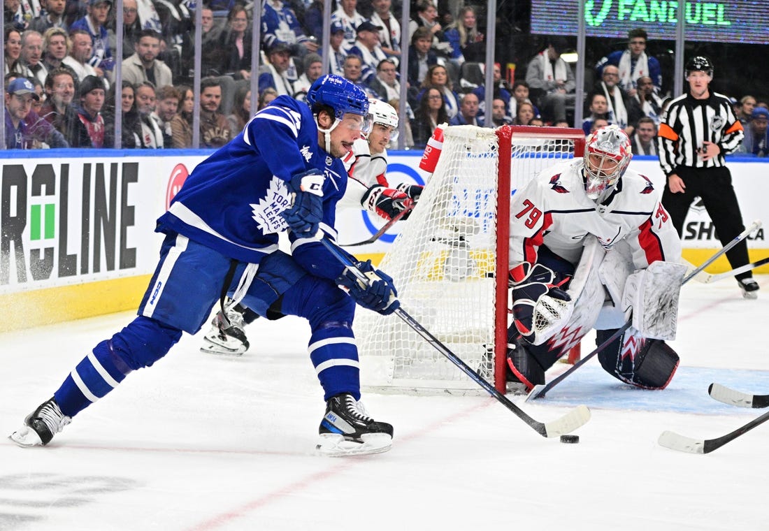 Oct 13, 2022; Toronto, Ontario, CAN;  Toronto Maple Leafs forward Auston Matthews (34) shoots as Washington Capitals goalie Charlie Lindgren (79) defends in the first period at Scotiabank Arena. Mandatory Credit: Dan Hamilton-USA TODAY Sports