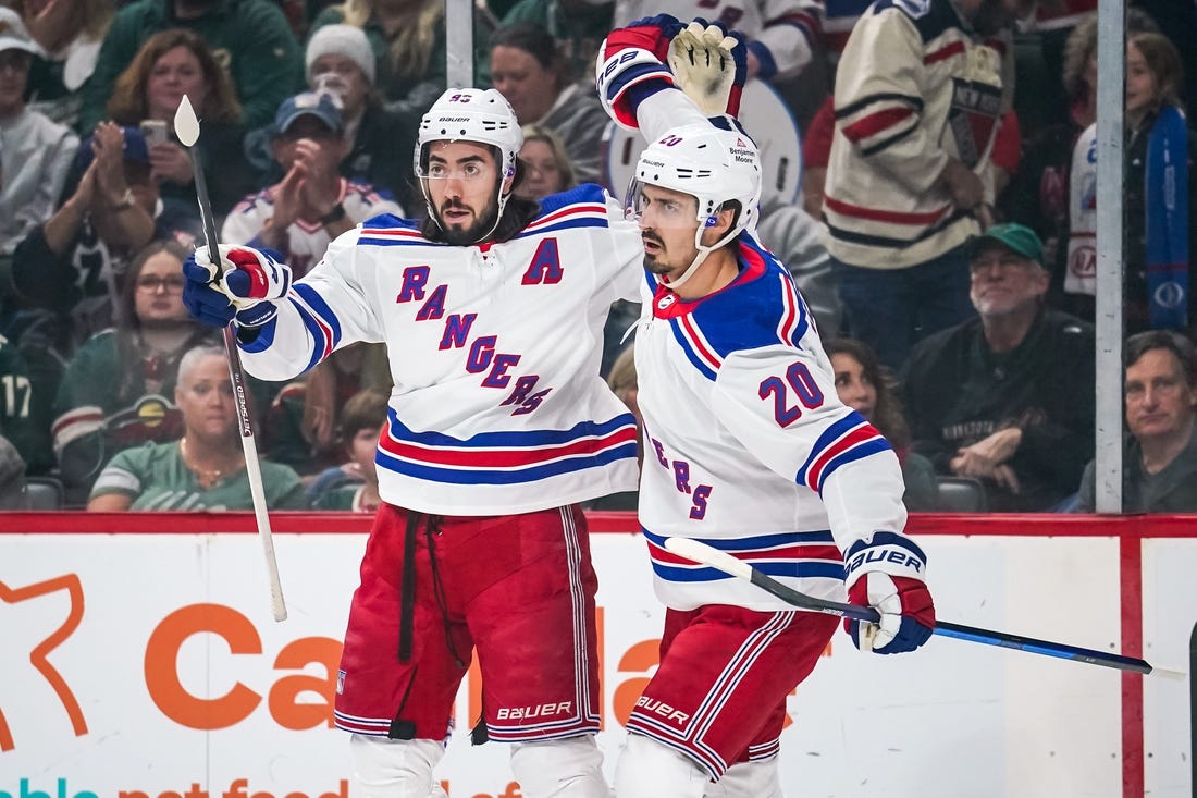 Oct 13, 2022; Saint Paul, Minnesota, USA; New York Rangers left wing Chris Kreider (20) celebrates his goal with center Mika Zibanejad (93) during the first period against the Minnesota Wild at Xcel Energy Center. Mandatory Credit: Brace Hemmelgarn-USA TODAY Sports