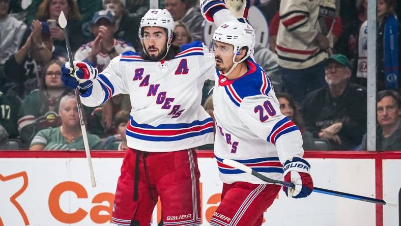 Oct 13, 2022; Saint Paul, Minnesota, USA; New York Rangers left wing Chris Kreider (20) celebrates his goal with center Mika Zibanejad (93) during the first period against the Minnesota Wild at Xcel Energy Center. Mandatory Credit: Brace Hemmelgarn-USA TODAY Sports