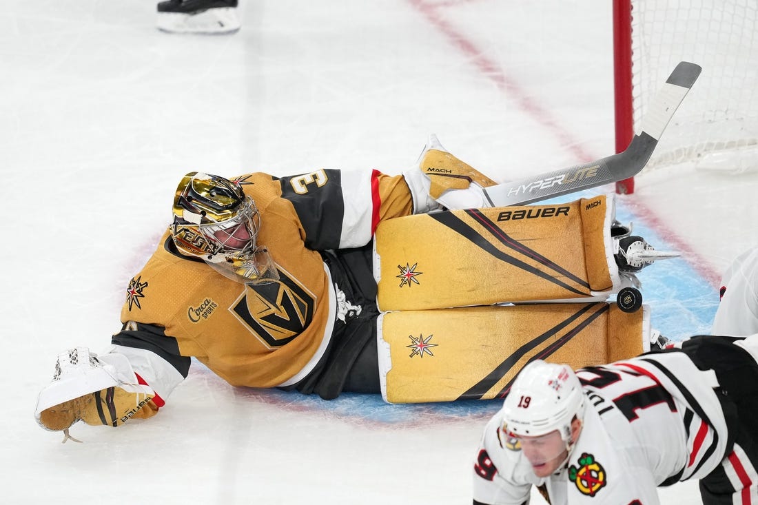 Oct 13, 2022; Las Vegas, Nevada, USA; Vegas Golden Knights goaltender Logan Thompson (36) makes a save against the Chicago Blackhawks during the first period at T-Mobile Arena. Mandatory Credit: Stephen R. Sylvanie-USA TODAY Sports