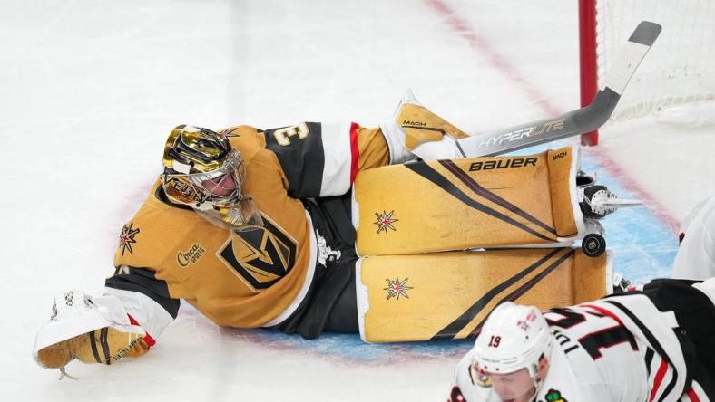 Oct 13, 2022; Las Vegas, Nevada, USA; Vegas Golden Knights goaltender Logan Thompson (36) makes a save against the Chicago Blackhawks during the first period at T-Mobile Arena. Mandatory Credit: Stephen R. Sylvanie-USA TODAY Sports