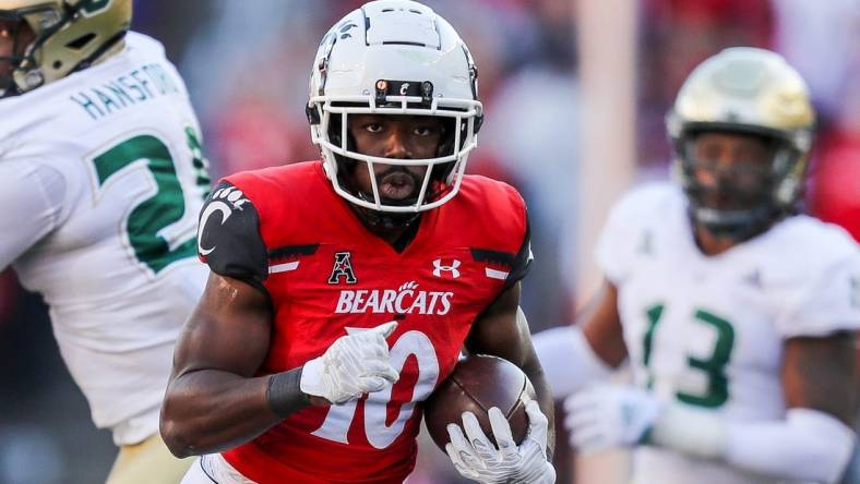 Oct 8, 2022; Cincinnati, Ohio, USA; Cincinnati Bearcats running back Charles McClelland (10) runs with the ball against the South Florida Bulls in the second half at Nippert Stadium. Mandatory Credit: Katie Stratman-USA TODAY Sports