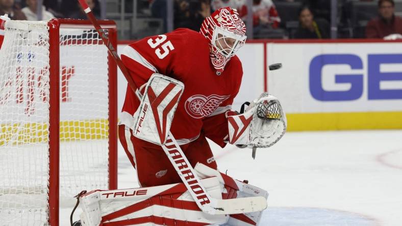 Oct 14, 2022; Detroit, Michigan, USA;  Detroit Red Wings goaltender Ville Husso (35) makes a save in the first period against the Montreal Canadiens at Little Caesars Arena. Mandatory Credit: Rick Osentoski-USA TODAY Sports