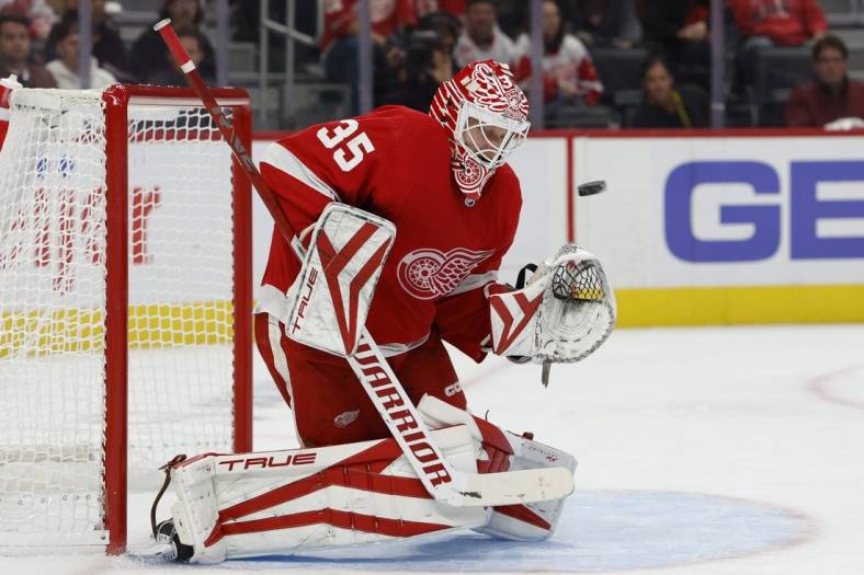 Oct 14, 2022; Detroit, Michigan, USA;  Detroit Red Wings goaltender Ville Husso (35) makes a save in the first period against the Montreal Canadiens at Little Caesars Arena. Mandatory Credit: Rick Osentoski-USA TODAY Sports