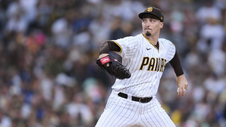 Oct 14, 2022; San Diego, California, USA; San Diego Padres starting pitcher Blake Snell (4) throws a pitch in the first inning against the Los Angeles Dodgers during game three of the NLDS for the 2022 MLB Playoffs at Petco Park. Mandatory Credit: Orlando Ramirez-USA TODAY Sports