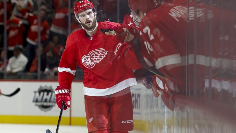 Oct 14, 2022; Detroit, Michigan, USA;  Detroit Red Wings center Michael Rasmussen (27) receives congratulations from teammates after scoring in the third period against the Montreal Canadiens at Little Caesars Arena. Mandatory Credit: Rick Osentoski-USA TODAY Sports