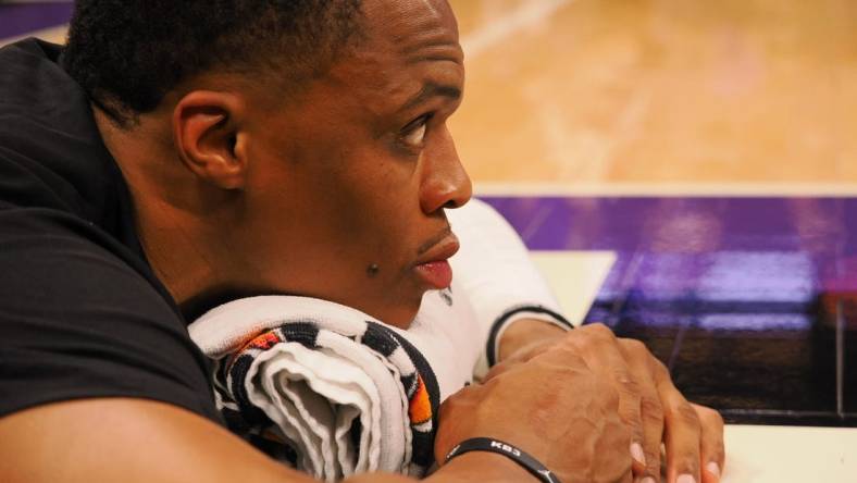 Oct 14, 2022; Sacramento, California, USA; Los Angeles Lakers point guard Russell Westbrook (0) stretches on the court before the game against the Sacramento Kings at Golden 1 Center. Mandatory Credit: Kelley L Cox-USA TODAY Sports