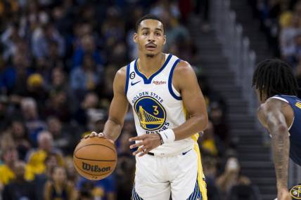 Oct 14, 2022; San Francisco, California, USA;  Golden State Warriors guard Jordan Poole (3) looks to pass against the Denver Nuggets during the second half at Chase Center. Mandatory Credit: John Hefti-USA TODAY Sports