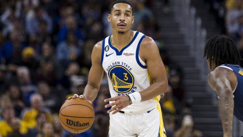 Oct 14, 2022; San Francisco, California, USA;  Golden State Warriors guard Jordan Poole (3) looks to pass against the Denver Nuggets during the second half at Chase Center. Mandatory Credit: John Hefti-USA TODAY Sports