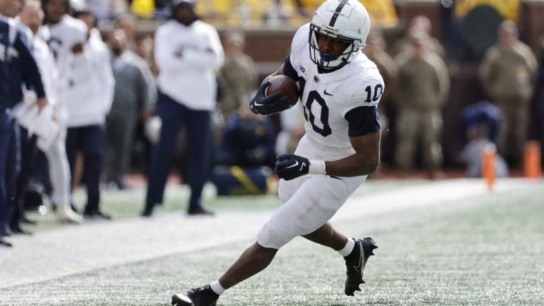 Oct 15, 2022; Ann Arbor, Michigan, USA;  Penn State Nittany Lions running back Nicholas Singleton (10) rushes in the second half against the Michigan Wolverines at Michigan Stadium. Mandatory Credit: Rick Osentoski-USA TODAY Sports