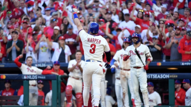 Oct 15, 2022; Philadelphia, Pennsylvania, USA; Philadelphia Phillies designated hitter Bryce Harper (3) gestures after hitting a home run in the eight inning against the Atlanta Braves in game four of the NLDS for the 2022 MLB Playoffs at Citizens Bank Park. Mandatory Credit: Eric Hartline-USA TODAY Sports