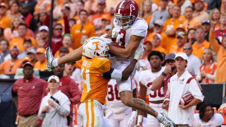 Oct 15, 2022; Knoxville, Tennessee, USA; Alabama Crimson Tide wide receiver Jermaine Burton (3) catches a pass against Tennessee Volunteers defensive back Christian Charles (14) during the second half at Neyland Stadium. Mandatory Credit: Randy Sartin-USA TODAY Sports