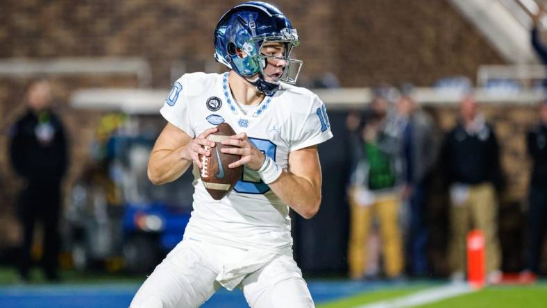 Oct 15, 2022; Durham, North Carolina, USA;  North Carolina Tar Heels quarterback Drake Maye (10) with the football during the first half at Wallace Wade Stadium. Mandatory Credit: Jaylynn Nash-USA TODAY Sports