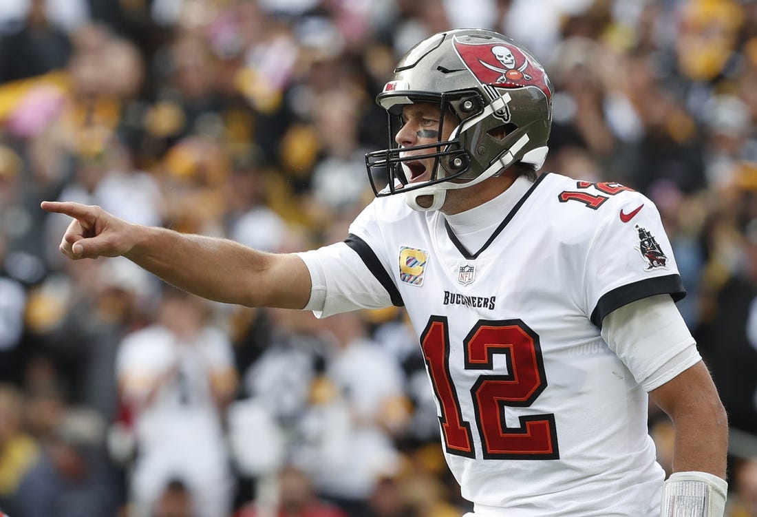 Oct 16, 2022; Pittsburgh, Pennsylvania, USA;  Tampa Bay Buccaneers quarterback Tom Brady (12) gestures at the line of scrimmage against the Pittsburgh Steelers during the fourth quarter at Acrisure Stadium. Pittsburgh won 20-18. Mandatory Credit: Charles LeClaire-USA TODAY Sports