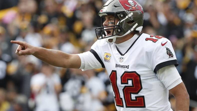 Oct 16, 2022; Pittsburgh, Pennsylvania, USA;  Tampa Bay Buccaneers quarterback Tom Brady (12) gestures at the line of scrimmage against the Pittsburgh Steelers during the fourth quarter at Acrisure Stadium. Pittsburgh won 20-18. Mandatory Credit: Charles LeClaire-USA TODAY Sports