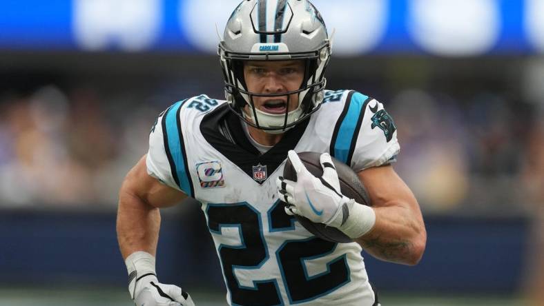 Oct 16, 2022; Inglewood, California, USA; Carolina Panthers running back Christian McCaffrey (22) carries the ball against the Los Angeles Rams in the first half at SoFi Stadium. Mandatory Credit: Kirby Lee-USA TODAY Sports