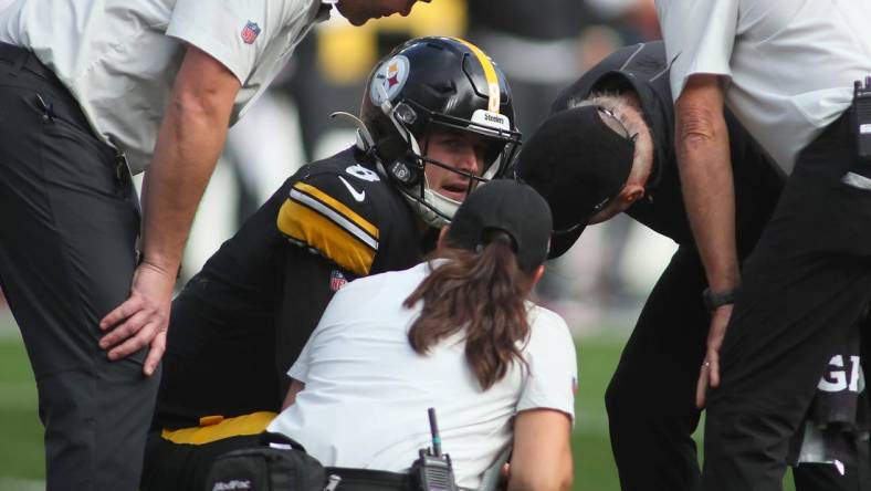 Kenny Pickett (8) of the Pittsburgh Steelers talks to the Steelers medical staff after being sacked during the second half against the Tampa Bay Buccaneers at Acrisure Stadium in Pittsburgh, PA on October 16, 2022.

Pittsburgh Steelers Vs Tampa Bay Buccaneers Week 6