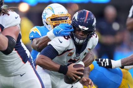 Oct 17, 2022; Inglewood, California, USA; Denver Broncos quarterback Russell Wilson (3) is sacked by Los Angeles Chargers linebacker Khalil Mack (52) in the first half at SoFi Stadium. Mandatory Credit: Kirby Lee-USA TODAY Sports