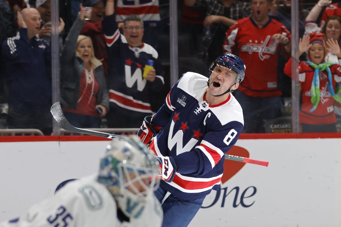 Oct 17, 2022; Washington, District of Columbia, USA; Washington Capitals left wing Alex Ovechkin (8) celebrates after scoring a goal on Vancouver Canucks goaltender Thatcher Demko (35) in the third period at Capital One Arena. Mandatory Credit: Geoff Burke-USA TODAY Sports