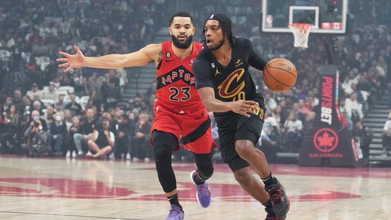 Oct 19, 2022; Toronto, Ontario, CAN; Cleveland Cavaliers guard Darius Garland (10) controls the ball as Toronto Raptors guard Fred VanVleet (23) tries to defend during the first quarter at Scotiabank Arena. Mandatory Credit: Nick Turchiaro-USA TODAY Sports