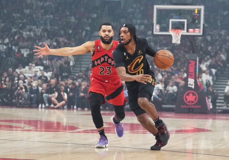 Oct 19, 2022; Toronto, Ontario, CAN; Cleveland Cavaliers guard Darius Garland (10) controls the ball as Toronto Raptors guard Fred VanVleet (23) tries to defend during the first quarter at Scotiabank Arena. Mandatory Credit: Nick Turchiaro-USA TODAY Sports