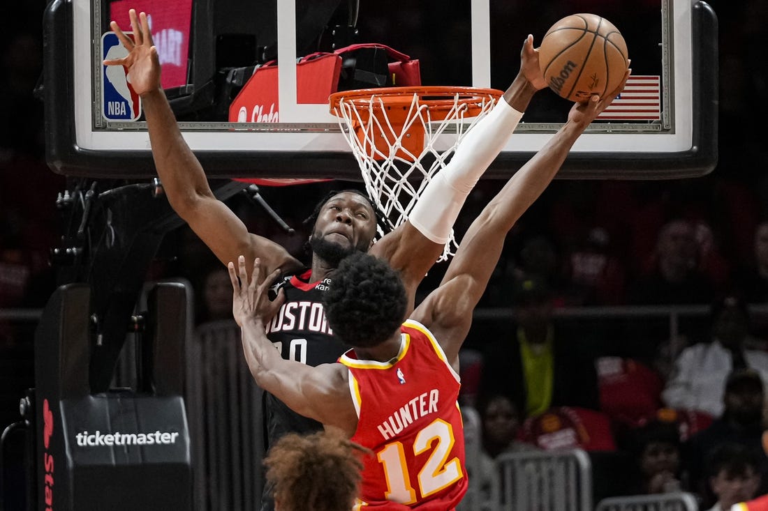 Oct 19, 2022; Atlanta, Georgia, USA; Houston Rockets forward Bruno Fernando (20) blocks a shot by Atlanta Hawks forward De'Andre Hunter (12) during the first quarter at State Farm Arena. Mandatory Credit: Dale Zanine-USA TODAY Sports