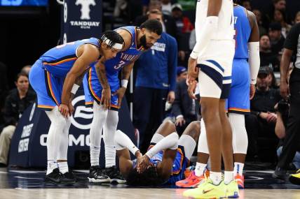 Oct 19, 2022; Minneapolis, Minnesota, USA; Oklahoma City Thunder forward Jalen Williams (8) lays on the court after being injured in the second quarter against the Minnesota Timberwolves at Target Center. Mandatory Credit: Matt Krohn-USA TODAY Sports