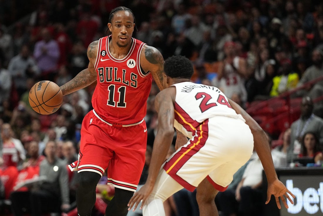 Oct 19, 2022; Miami, Florida, USA; Chicago Bulls forward DeMar DeRozan (11) brings the ball up the court as Miami Heat forward Haywood Highsmith (24) defends in the first half at FTX Arena. Mandatory Credit: Jim Rassol-USA TODAY Sports