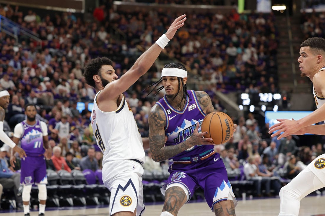 Oct 19, 2022; Salt Lake City, Utah, USA;  Utah Jazz guard Jordan Clarkson (00) tries to get past Denver Nuggets guard Jamal Murray (27) during the second half at Vivint Arena. Mandatory Credit: Chris Nicoll-USA TODAY Sports