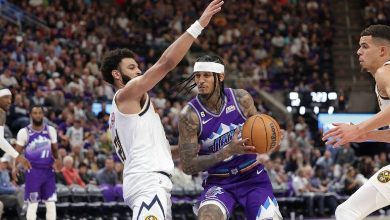 Oct 19, 2022; Salt Lake City, Utah, USA;  Utah Jazz guard Jordan Clarkson (00) tries to get past Denver Nuggets guard Jamal Murray (27) during the second half at Vivint Arena. Mandatory Credit: Chris Nicoll-USA TODAY Sports