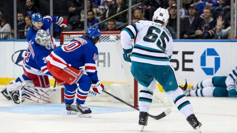 Oct 20, 2022; New York, New York, USA; San Jose Sharks defenseman Erik Karlsson (65) scores the game-winning goal in overtime against the New York Rangers at Madison Square Garden. Mandatory Credit: Danny Wild-USA TODAY Sports