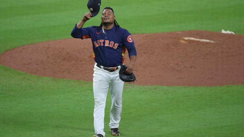 Oct 20, 2022; Houston, Texas, USA; Houston Astros starting pitcher Framber Valdez (59) reacts after completing the seventh inning against the New York Yankees during game two of the ALCS for the 2022 MLB Playoffs at Minute Maid Park. Mandatory Credit: Erik Williams-USA TODAY Sports