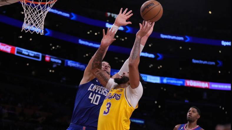 Oct 20, 2022; Los Angeles, California, USA; Los Angeles Lakers forward Anthony Davis (3) shoots the ball against LA Clippers center Ivica Zubac (40) in the first half at Crypto.com Arena. Mandatory Credit: Kirby Lee-USA TODAY Sports