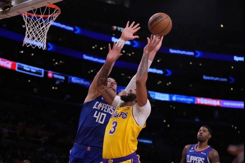 Oct 20, 2022; Los Angeles, California, USA; Los Angeles Lakers forward Anthony Davis (3) shoots the ball against LA Clippers center Ivica Zubac (40) in the first half at Crypto.com Arena. Mandatory Credit: Kirby Lee-USA TODAY Sports
