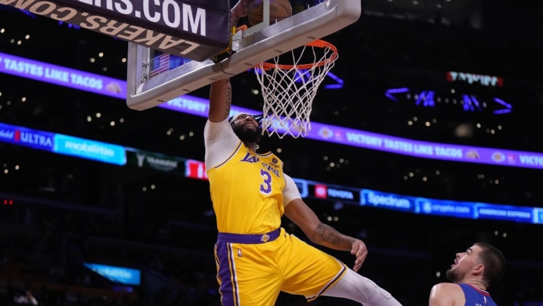 Oct 20, 2022; Los Angeles, California, USA; Los Angeles Lakers forward Anthony Davis (3) dunks the ball against LA Clippers  in the first half at Crypto.com Arena. Mandatory Credit: Kirby Lee-USA TODAY Sports