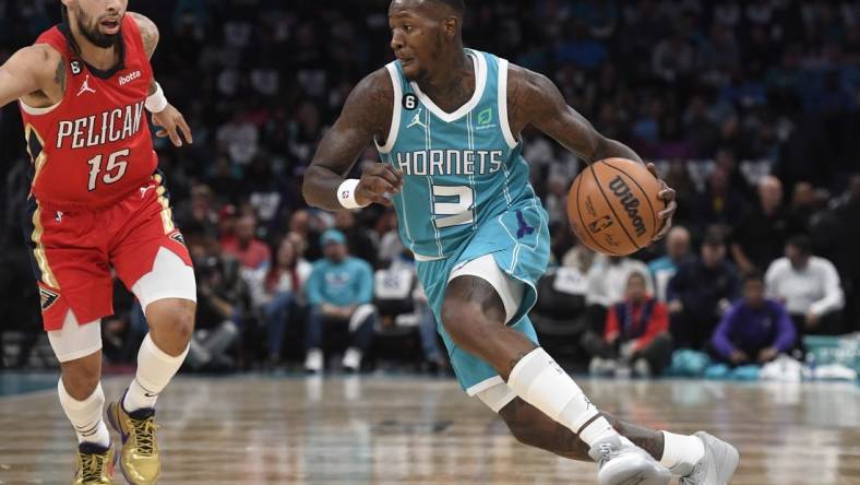 Oct 21, 2022; Charlotte, North Carolina, USA; Charlotte Hornets guard Terry Rozier (3) drives past New Orleans Pelicans guard Jose Alvarado (15) during the first half at the Spectrum Center. Mandatory Credit: Sam Sharpe-USA TODAY Sports