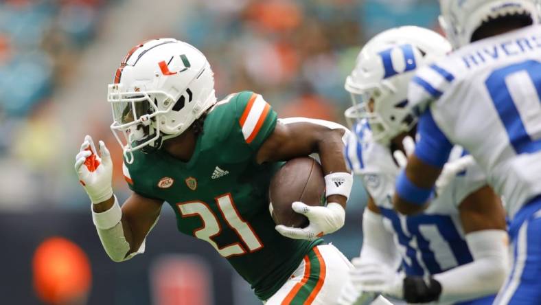 Oct 22, 2022; Miami Gardens, Florida, USA; Miami Hurricanes running back Henry Parrish Jr. (21) runs with the football during the first quarter against the Duke Blue Devils at Hard Rock Stadium. Mandatory Credit: Sam Navarro-USA TODAY Sports