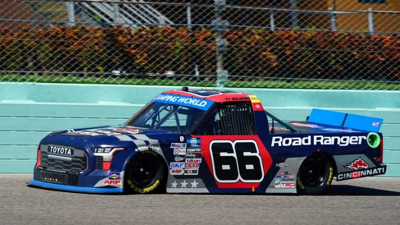 Oct 22, 2022; Homestead, Florida, USA; Camping World Truck Series driver Ty Majeski (66) races on the final lap winning the Baptist Health 200 at Homestead-Miami Speedway. Mandatory Credit: John David Mercer-USA TODAY Sports